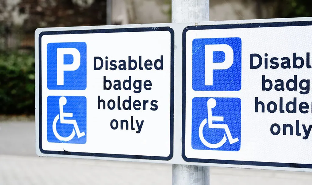 A disabled parking sign