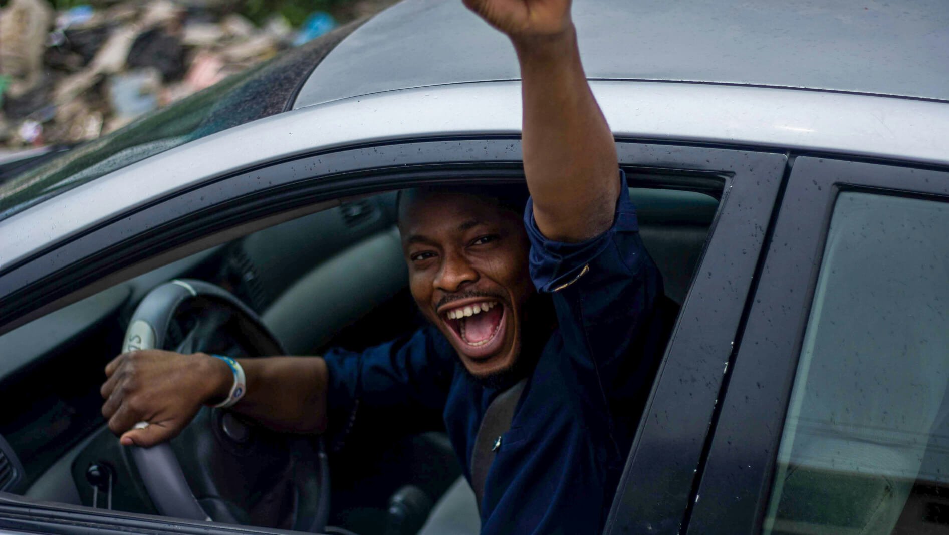 Man happy in car