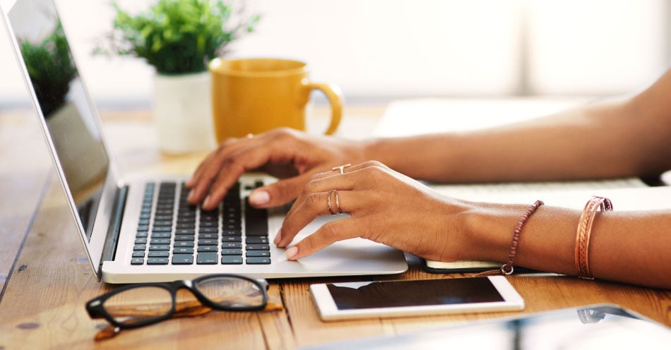 Keep up with the industry latest and the current trending topics A consumer using a laptop at their desk