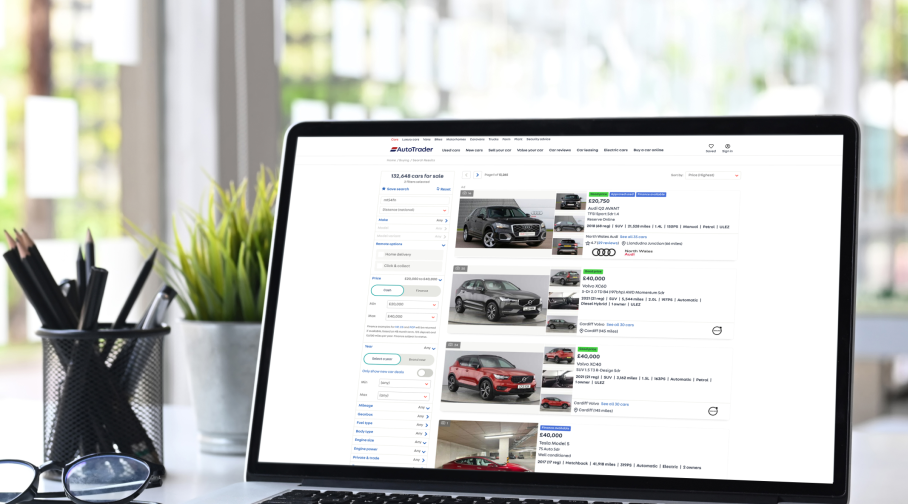 A laptop displaying search listings from Autotrader